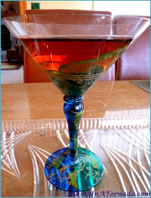 Pomegranate Martini, a simple martini packed with flavor | Recipe developed by www.BakingInATornado.com | #recipe #cocktail