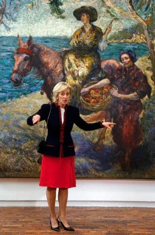 Belgium's Princess Astrid, gestures to the media as she poses for a photo during her visits to the Modern Art Museum of Bogota