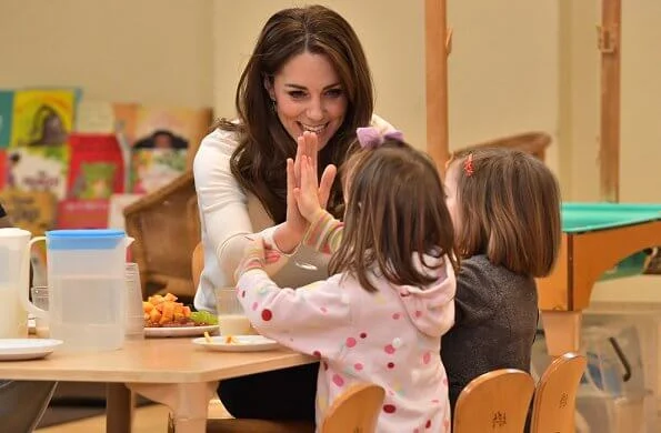 Kate Middleton wore Sezane Tulio jumper, Russell and Bromley FAB Dry ankle boots, Accessorize Filigree gold earrings, a blue wool coat