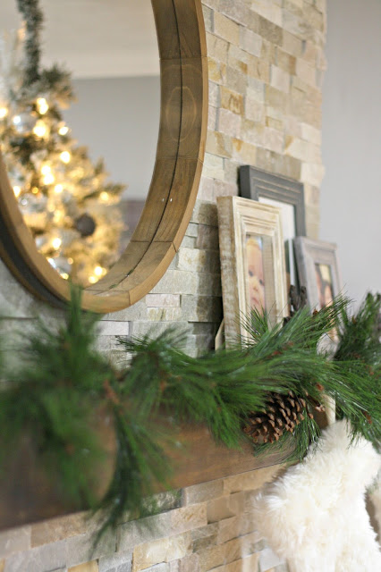 stone fireplace with wood mantel