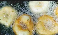 Deep frying medu vada till crisp golden for medu vada recipe