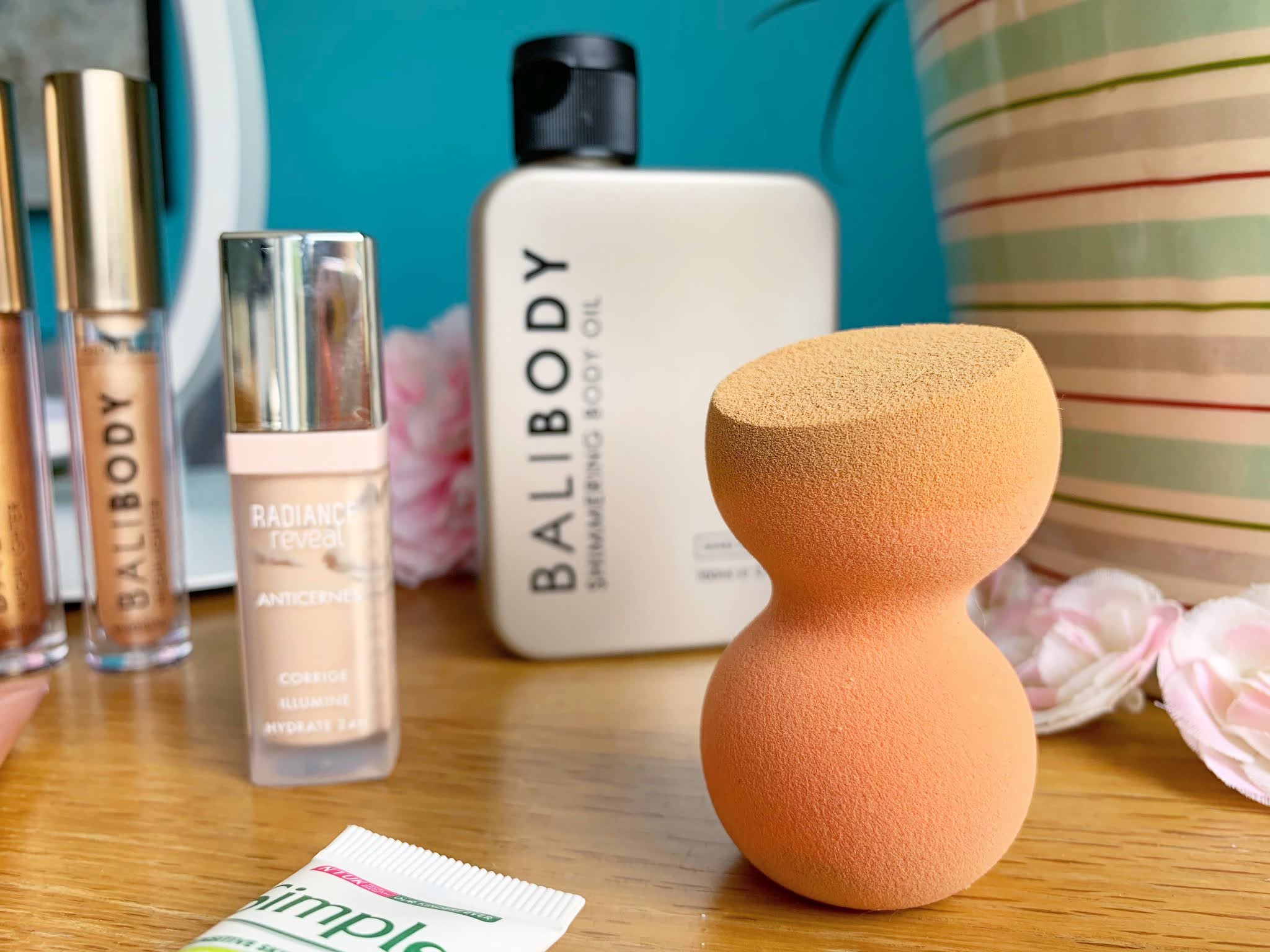 Essence Super Beauty Makeup Sponge Essence Super Beauty Makeup Sponge on a side table with a blue background
