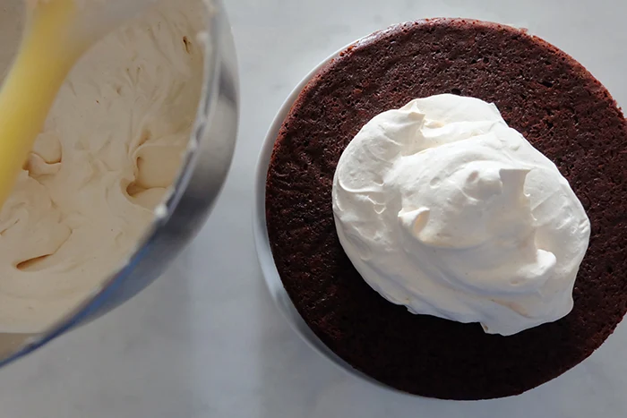 Mexican Chocolate Cake with Mascarpone Whipped Cream Frosting layer half
