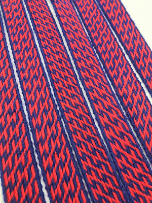 A photograph of a tablet woven band made using the pattern above
