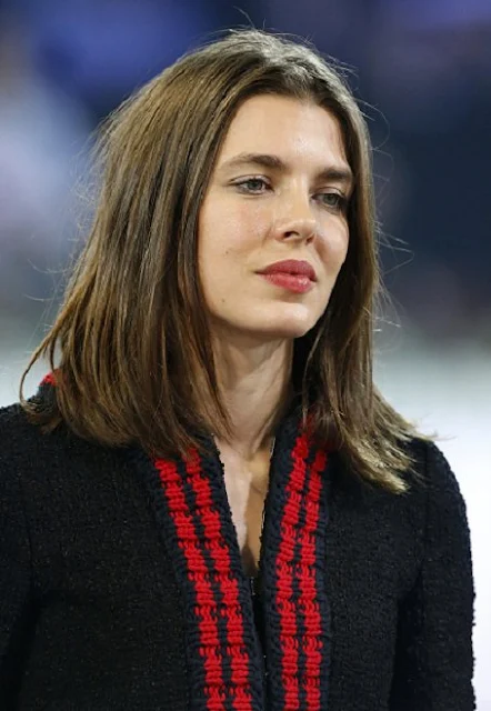 Charlotte Casiraghi  present the trophies to the GUCCI Gold Cup (CSI5) podium, winner Simon Delestre of France, second Patrice Delaveau of France  and third Maikel van der Vleuten of The Netherlands prior to the 'Style and Competition' show jumping charity event benefitting 'AMADE' on day three of the Longines Paris Masters 2015 held at the Paris-Nord Villepinte Exhibition Center