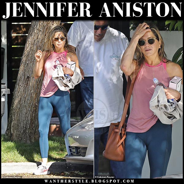 Jennifer Aniston in pink top, blue leggings and brown bucket bag
