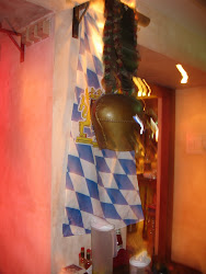 A German cow bell over the Bavarian Flag