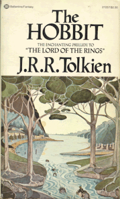 Cover of the Hobbit, by J R R Tolkien, featuring a watercolor image of trees and a river with barrels floating down it