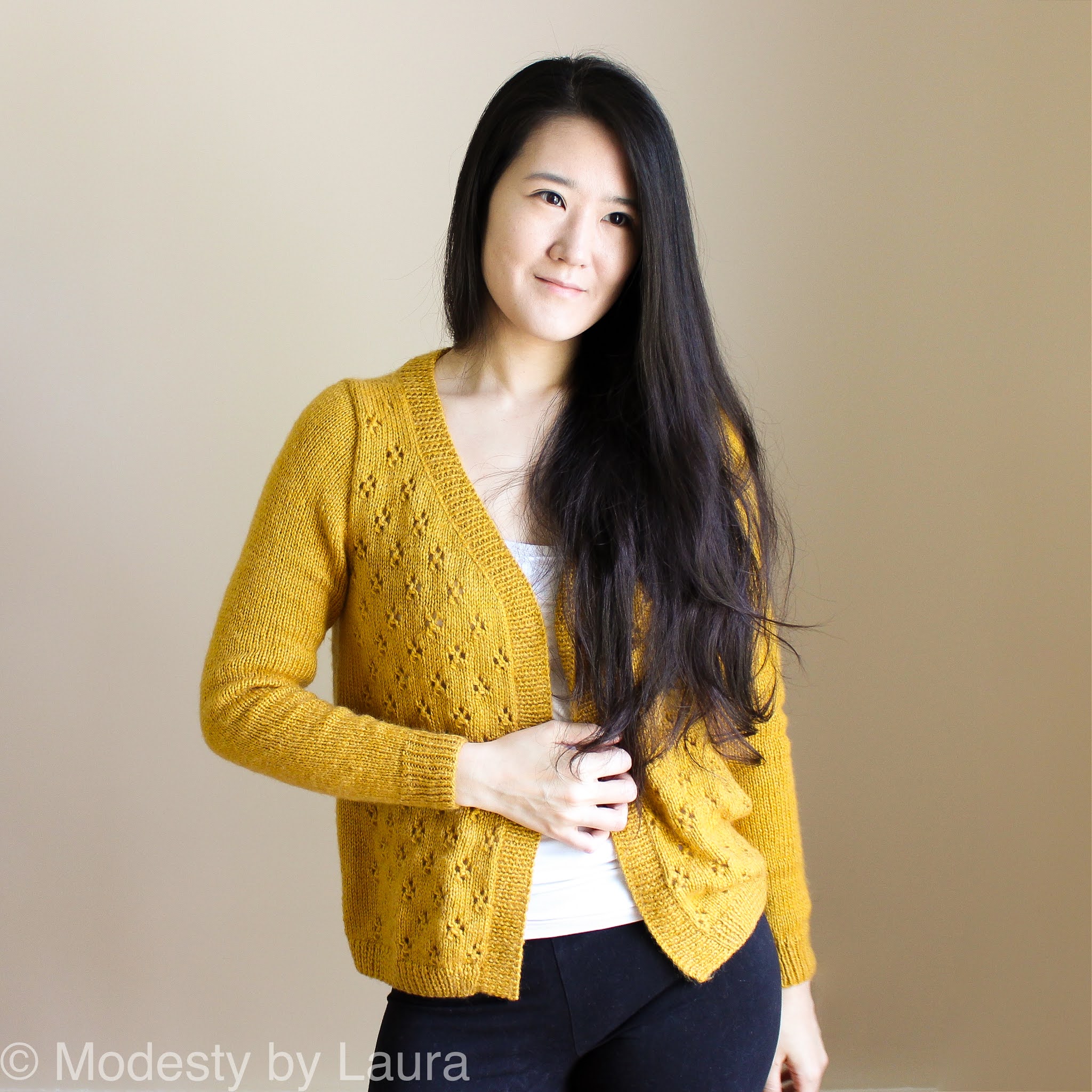 Designer of Modesty by Laura wearing a knit Cheese in the Trap Cardi