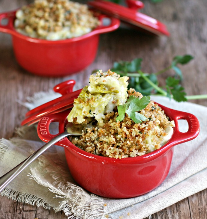 Recipe for a side dish of cabbage simmered in a cheesy sauce with a breadcrumb topping.