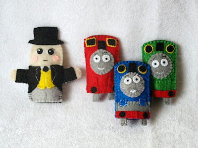 The full set of Thomas the Tank Engine felt finger puppets handmade by Joanne Rich for her friends daughter.
