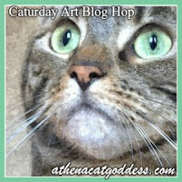 www.athenacatgoddess.com Stylized portrait of a tabby cat with green eyes, shown in close-up with artistic texture effects. The cat’s face is centered, highlighting its expressive eyes, nose, and whiskers. A mint green border frames the image. Text at the top reads “Caturday Art Blog Hop,” and at the bottom: “athenacatgoddess.com.” The design blends feline elegance with creative flair, ideal for showcasing pet-themed artistic content -https://www.athenacatgoddess.com/