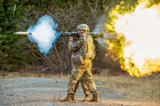 A servicemember fires a rocket launcher [Image Credit: U.S. Air Force, Alejandro Pentildea]