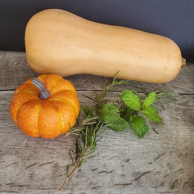 this is butternut squash with a pumpkin in it with rosemary and mint