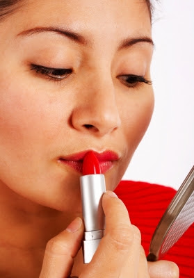 women fixing makeup mistakes in mirror