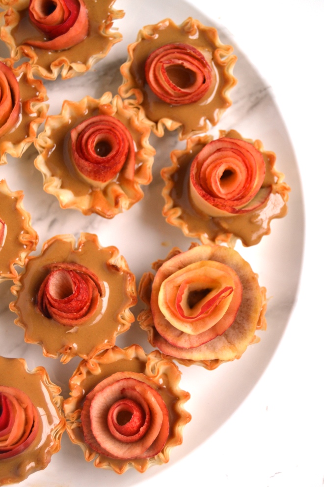 3-Ingredient Apple Rose Tarts are super simple to make and look impressive- no one will know how easy they were! Filled with warm, drippy peanut butter, fresh apples all in a crispy mini phyllo cup! www.nutritionistreviews.com