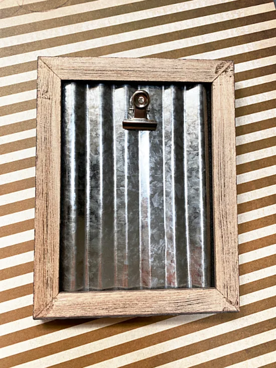 corrugated metal with a clip in a frame