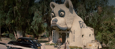 A movie still showing the Bulldog Cafe during the day.