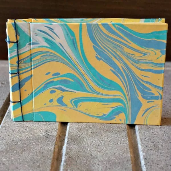 handmade sketchbook with marbled paper cover and stab binding