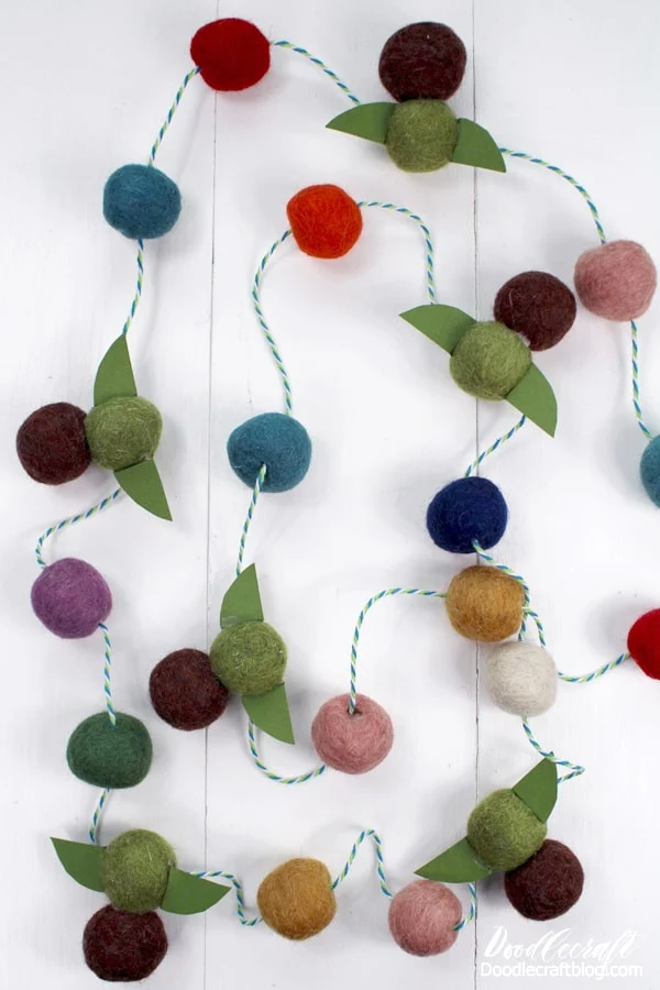 Make the cutest pom pom garland with Baby Yoda felt ornaments as a quick craft. Perfect for decorating for a Mandalorian themed party or Star Wars themed decorations. 