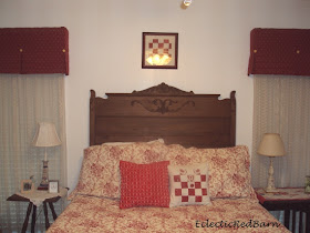 vintage bed frame, antique drapes, vintage quilt pillow, red matlesse spread