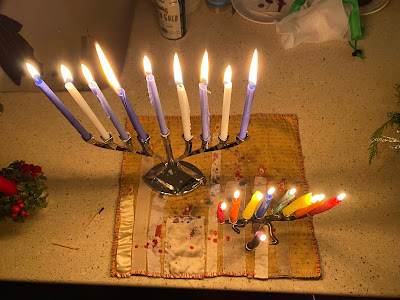 Two menorahs with all 8 candles lit