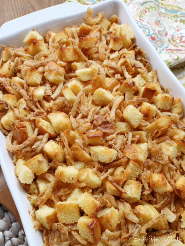 French Onion Chicken Casserole! An easy, creamy chicken noodle casserole with French onion soup, topped with toasty buttered bread cubes and crispy fried onions.