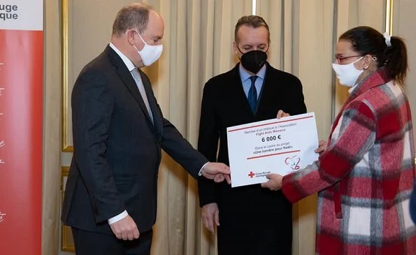 President of the Monaco Red Cross Prince Albert presented a check to Princess Stephanie