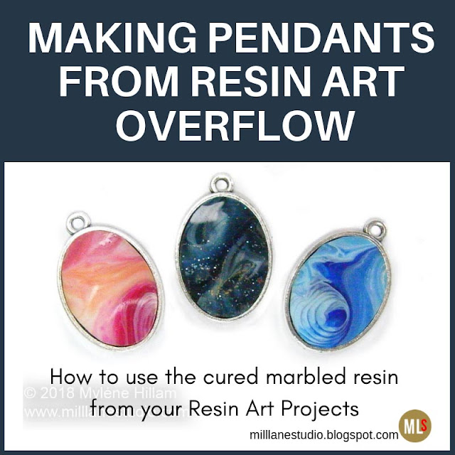 three marbled resin pendants