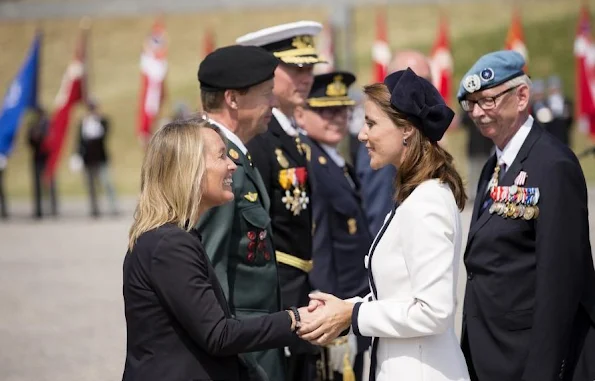 Princess Marie of Denmark participates In Internation Peacekeepers Day at The Citadel. Marie wears Paule Ka White Two-Tone Belted Coat, By Malene Birger Paxlow Pump