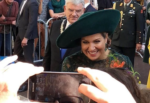 Dutch Queen Máxima attended Leidsche Rijn's 20th anniversary celebrations. Queen wore a green lace dress and pumps by Natan. diamond earrings