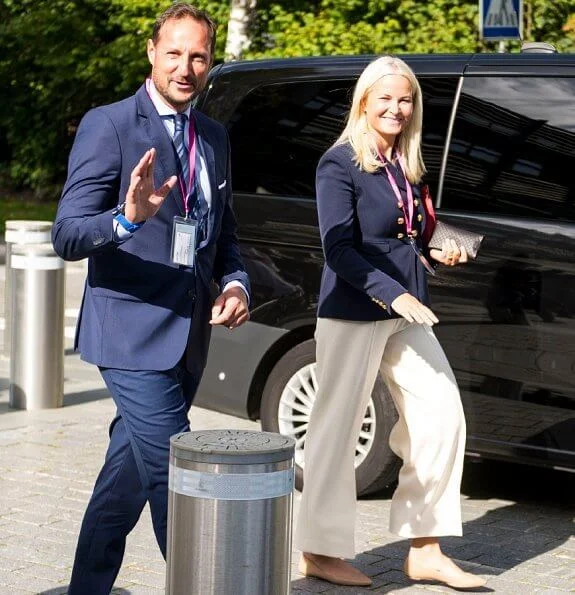 Crown Princess Mette Marit wore a seth double breasted gabardine blazer from Altuzarra, and crepe ivory wide-leg pants from Michael Kors