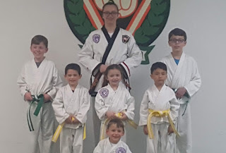 Martial arts students practicing modesty Martial arts students practicing and learning about modesty