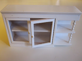 White modern miniature kitchen wall cupboard with display shelf end