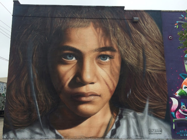 Italian photorealistic painter Jorit Agoch spent several days in The Bushwick Collective at the corner of Jefferson and St. Nicholas creating this amazing portrait of a luxuriously haired child.