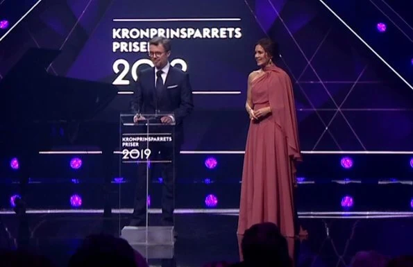 Crown Princess Mary wore a new bespoke gown by Danish fashion designer Soeren le Schmidt. Danish singer Jada, Emilie Molsted