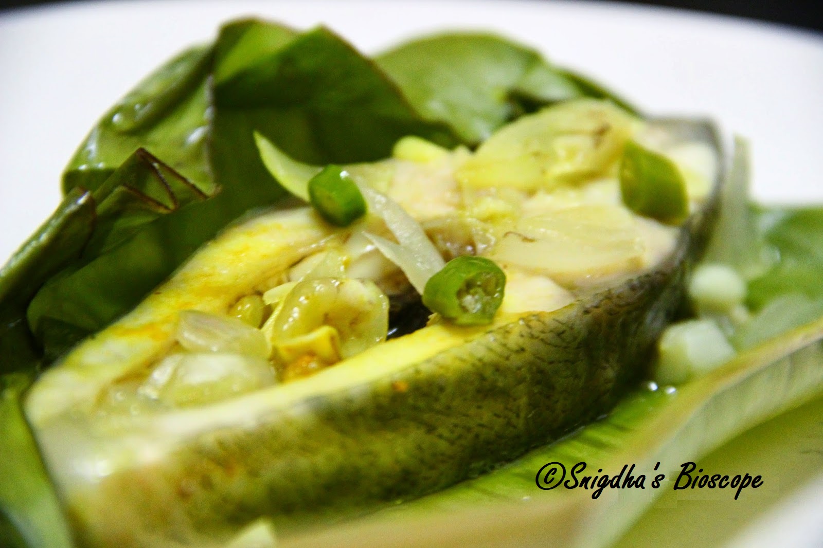 Steamed fish in banana leaf