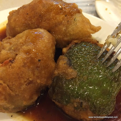 fried greed peppers stuffed with veggie meat at Buddha Bodai One Kosher Vegetarian Restaurant in NYC fried greed peppers stuffed with veggie meat at Buddha Bodai One Kosher Vegetarian Restaurant in NYC
