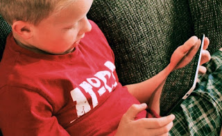 Child playing iPad