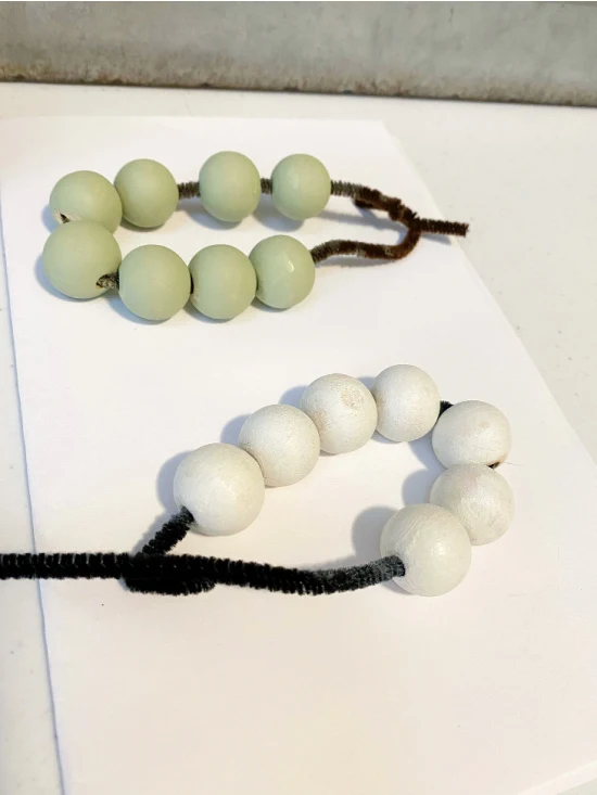 green and white painted beads