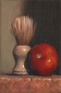 Oil painting of a red tomato beside a bone-coloured shaving brush.