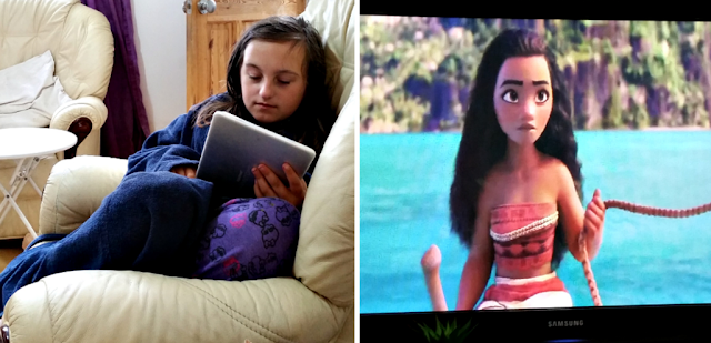 My youngest sat playing on her tablet and the film Moana on the TV