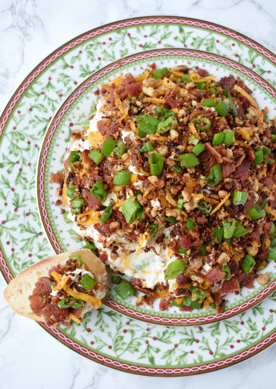 Bacon Walnut Cheese Ball features a cheese ball made with sharp cheddar cheese, fresh green onion, crispy bacon and bacon toasted walnuts. Served with garlic crostini for an indulgent, creamy and rich dip! #bacon #appetizer #cheeseball #cheese #holidays