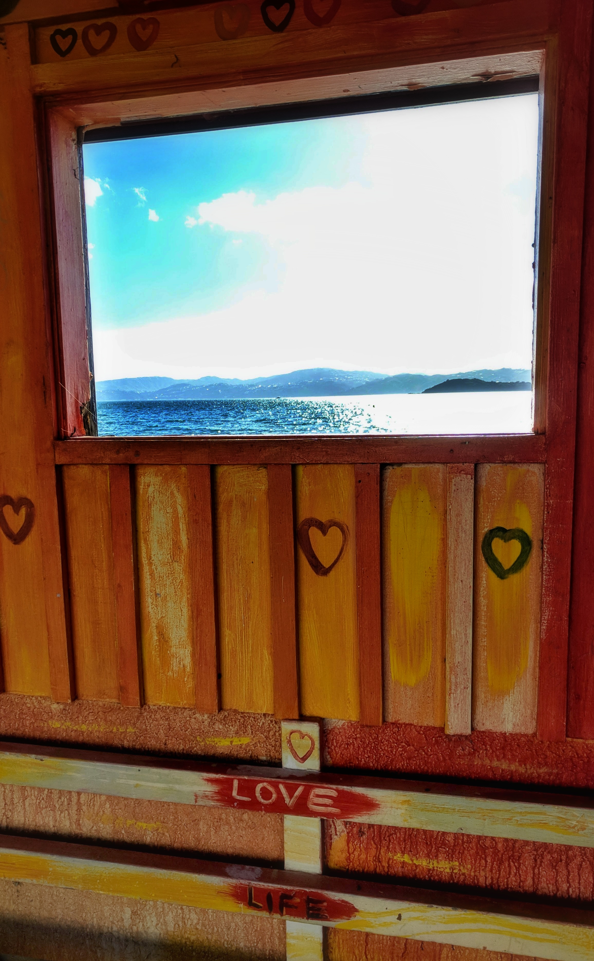 'Love Life' written on a bus stop with a view