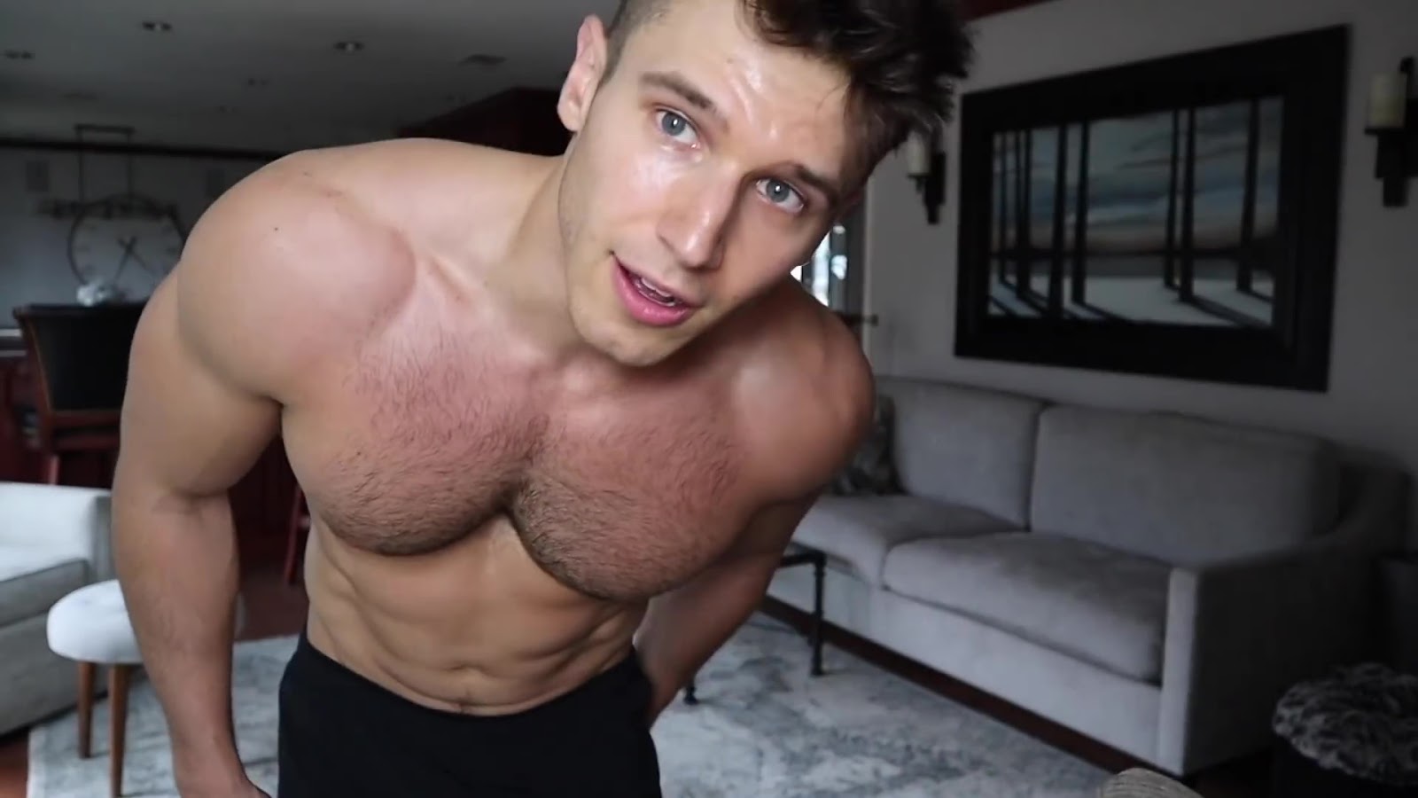 Sam Cushing shirtless on his home workout video.