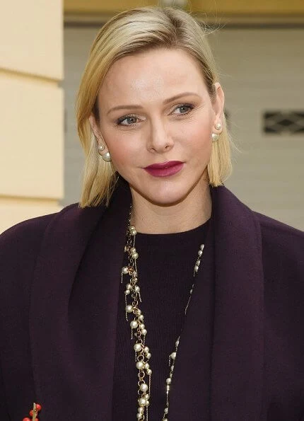 Princess Charlene wore a wool cashmere brown coat and brown long sleeve wool midi dress by Louis Vuitton