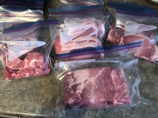 pork loin cut into roast, pork chops and stewing pork. Meat is bagged ready to freeze
