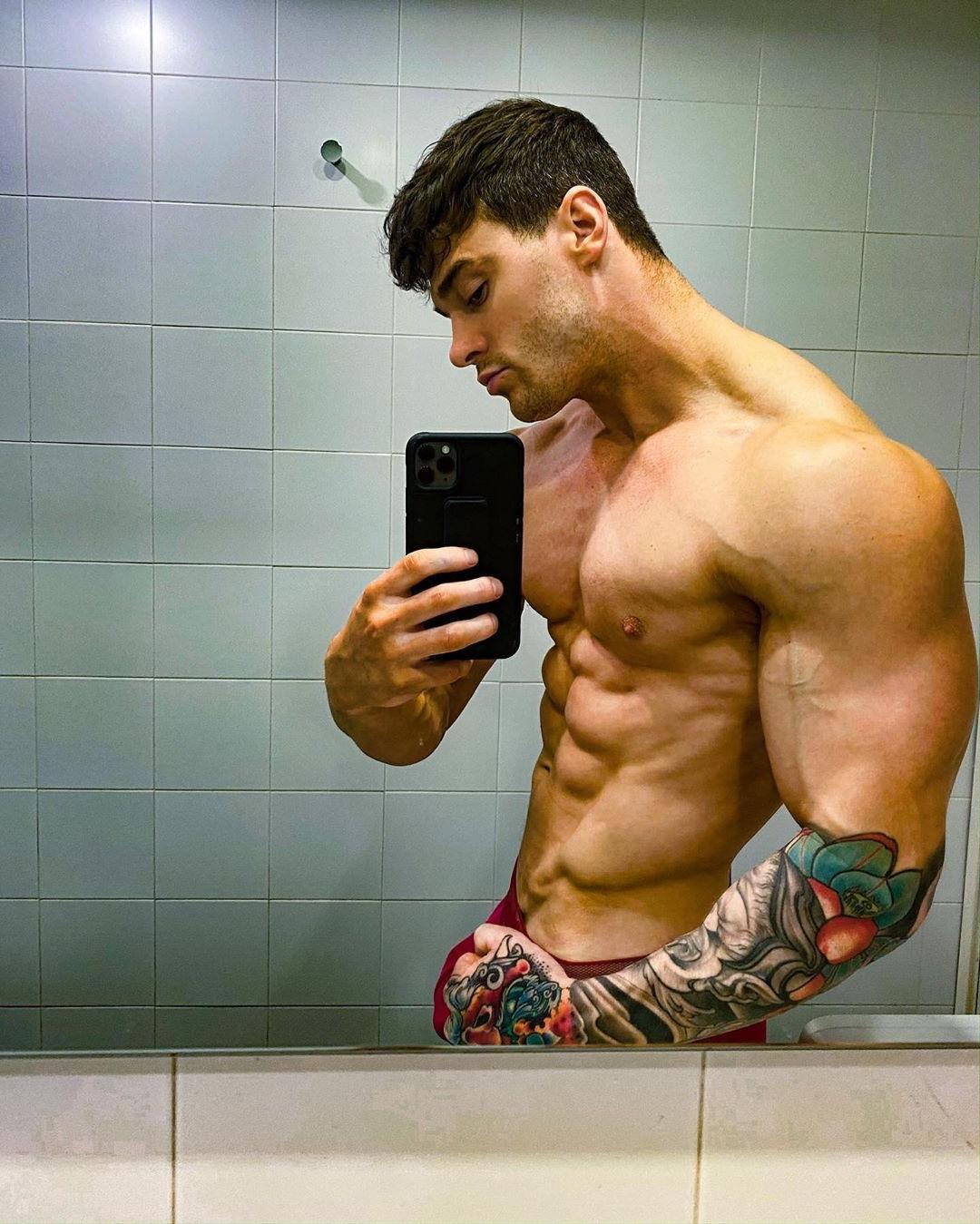 strong-shirtless-alpha-muscle-sixpack-abs-top-man-tattoo-arm-bathroom-mirror-selfie