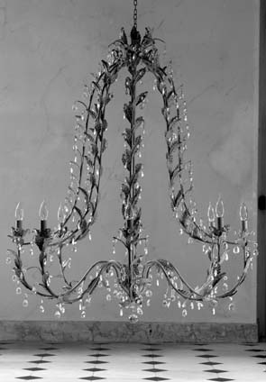 Wrought iron and crystal chandelier via Blanc d'Ivoire (fr) as seen on linenandlavender.net