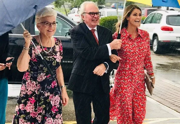 Princess Madeleine wore a new asymmetric paisley-print silk dress by Veronica Beard, and Ebba Brahe earrings. Leonore, Nicolas and Adrienne